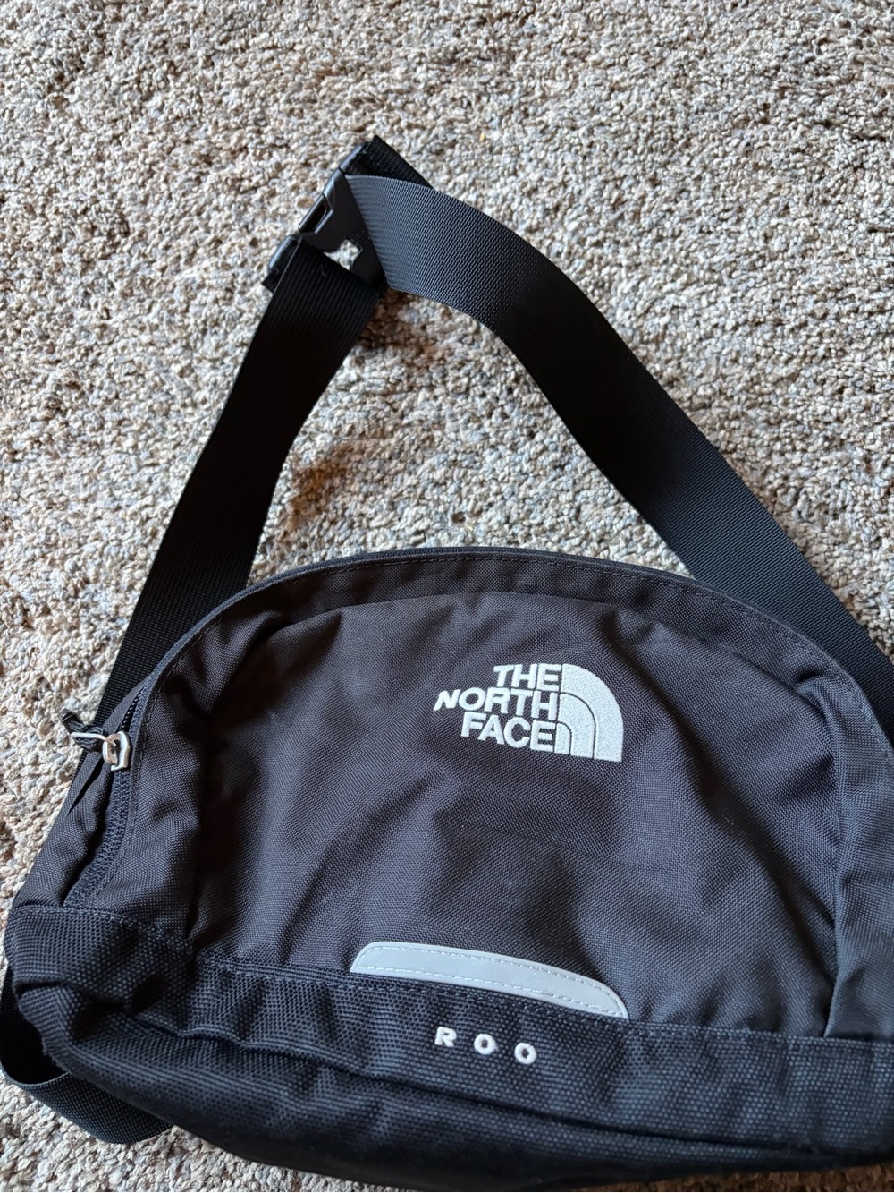 The North Face Black Sling Belt Bag with White Logo